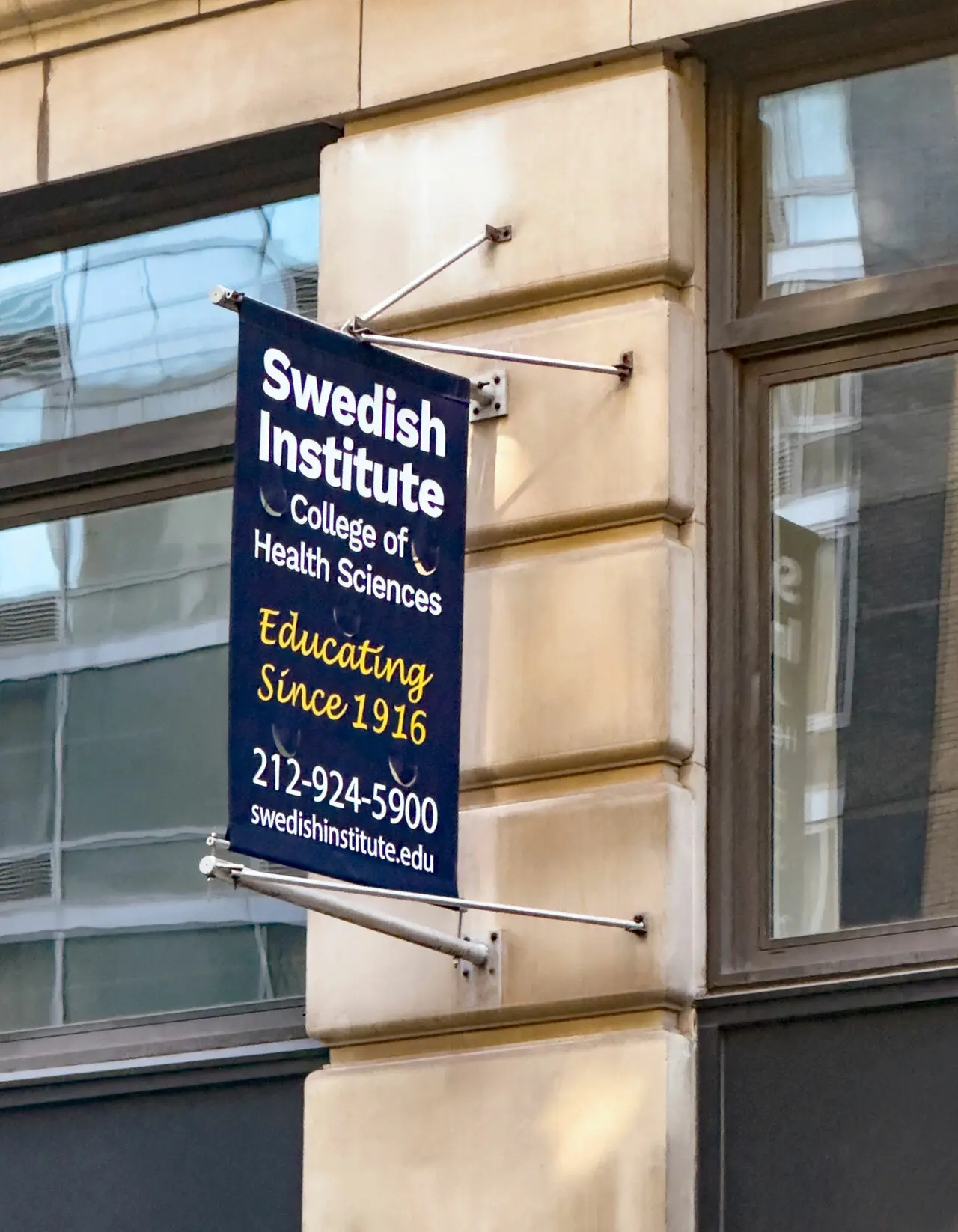 campus safety. Swedish Institute banner outside NYC campus location. 