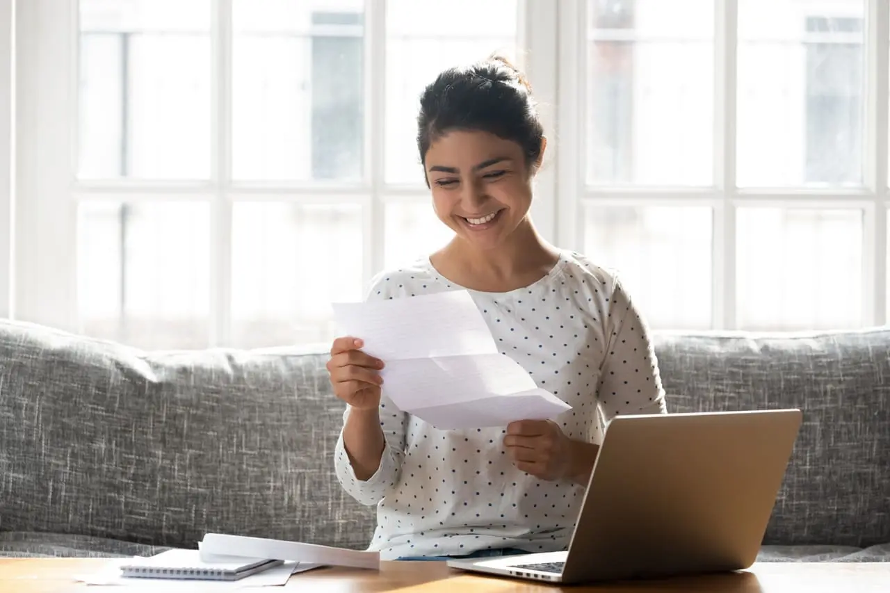 happy student reading a letter