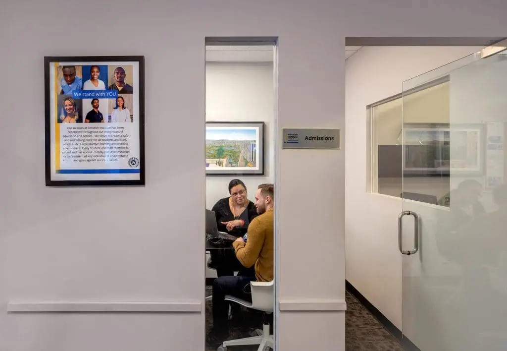 swedish institute admissions department. An admissions counselor works with a new student.