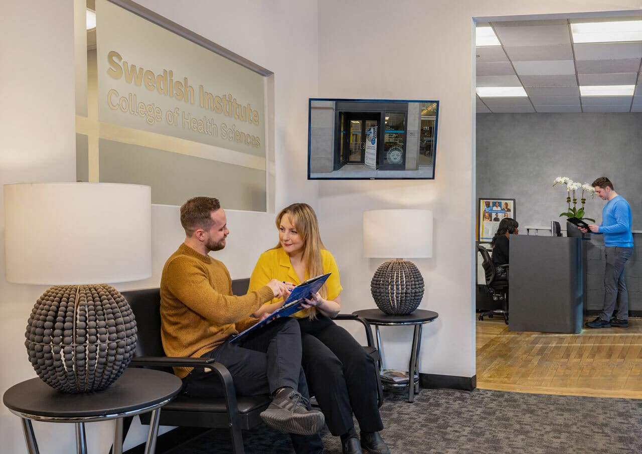 admissions counselor working with an applicant