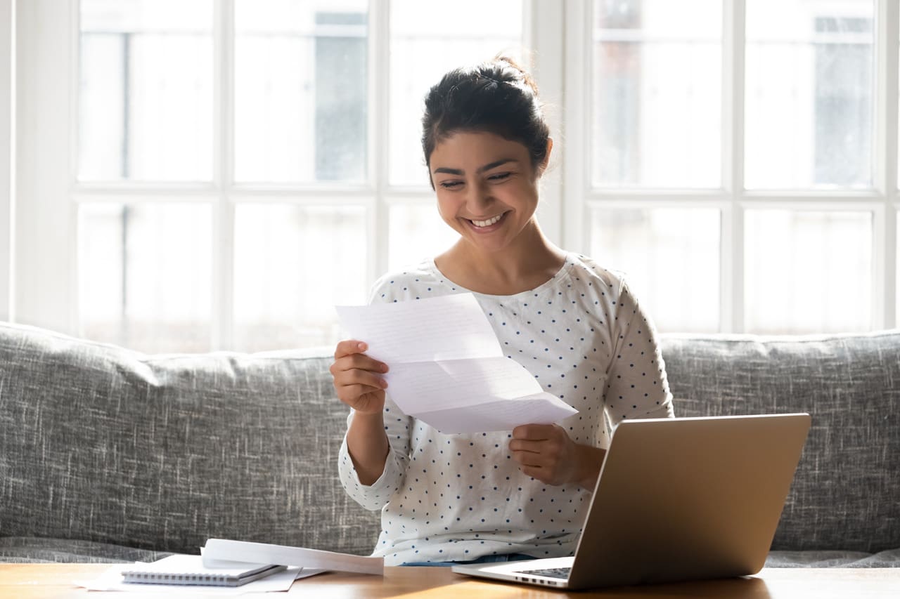 happy student reading a letter